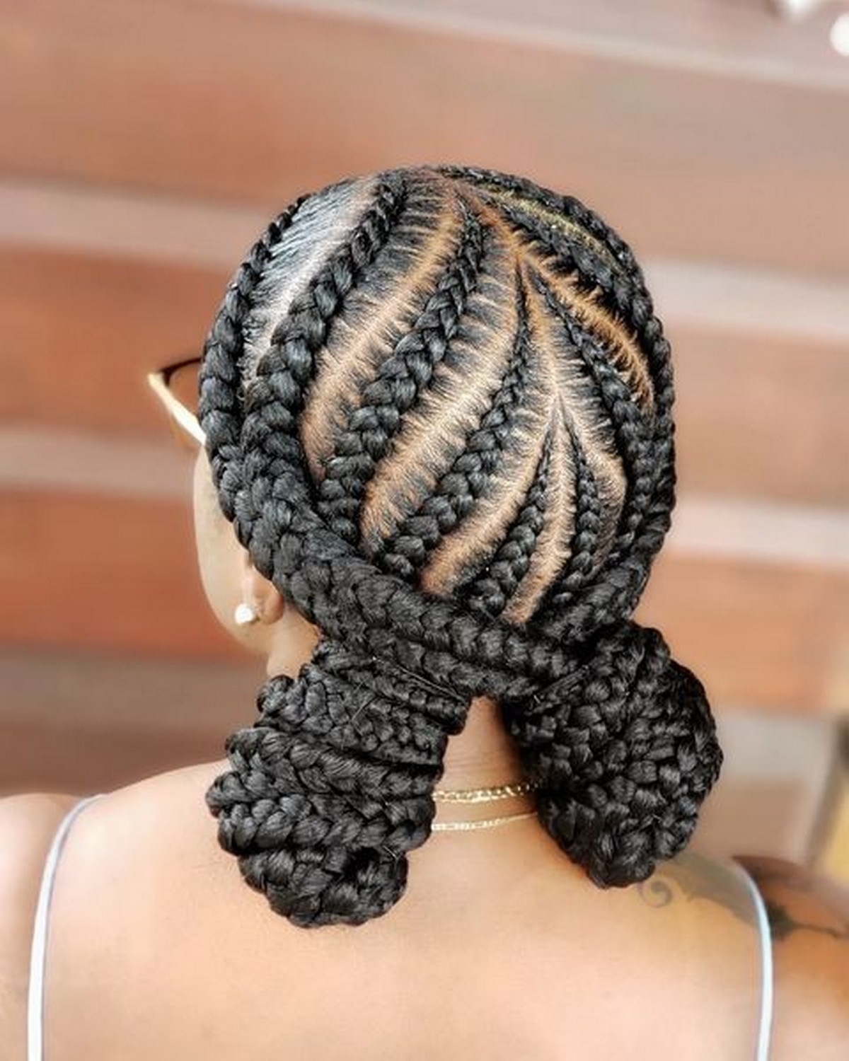 Large Tribal Braids With Two Low Buns