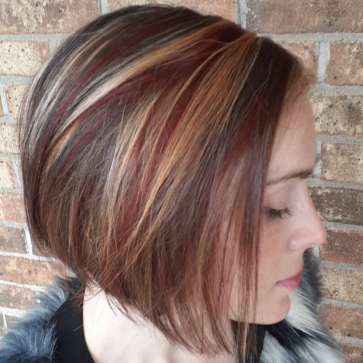 Layered Bob With Light Blonde And Red Highlights