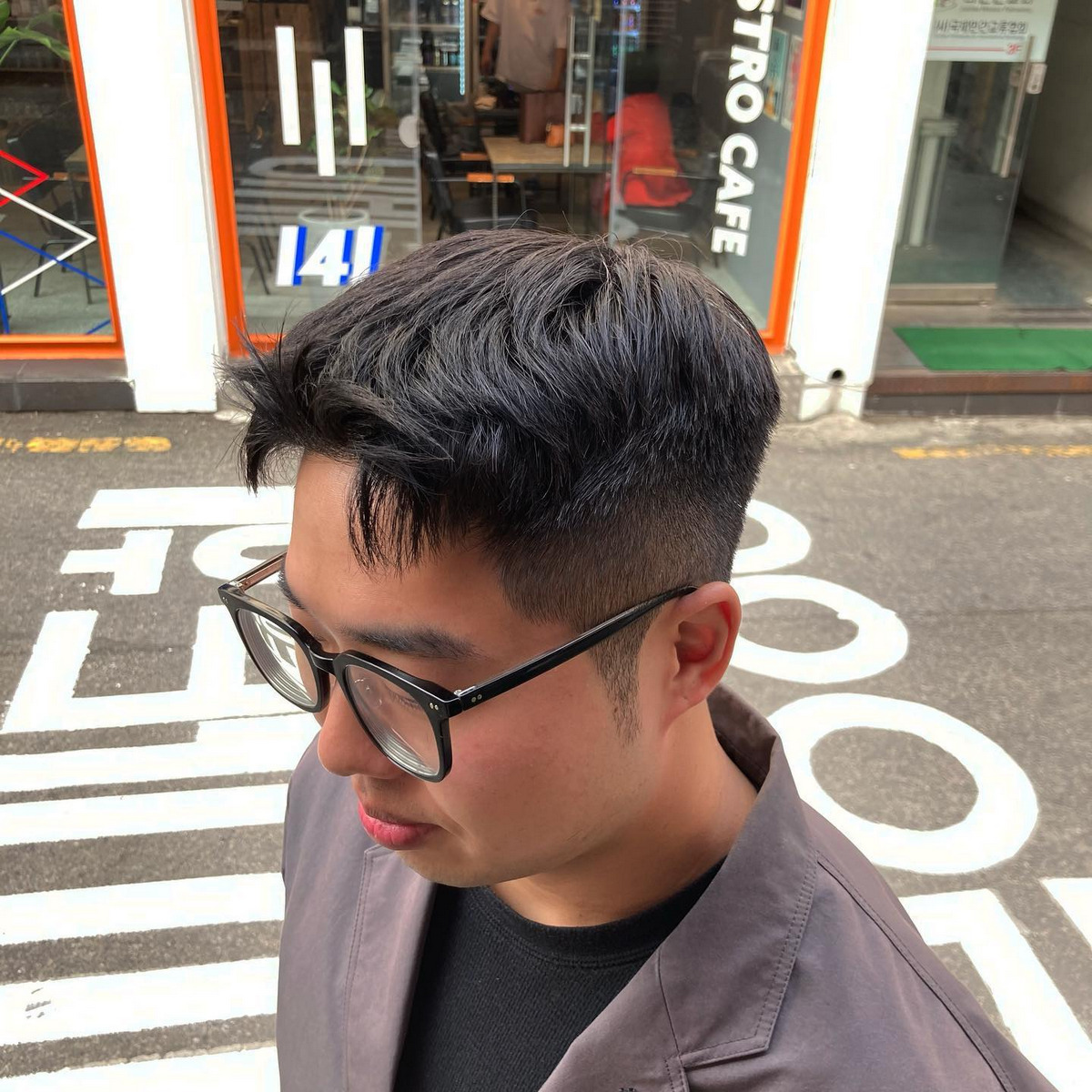 Slicked-back hair with sideburns