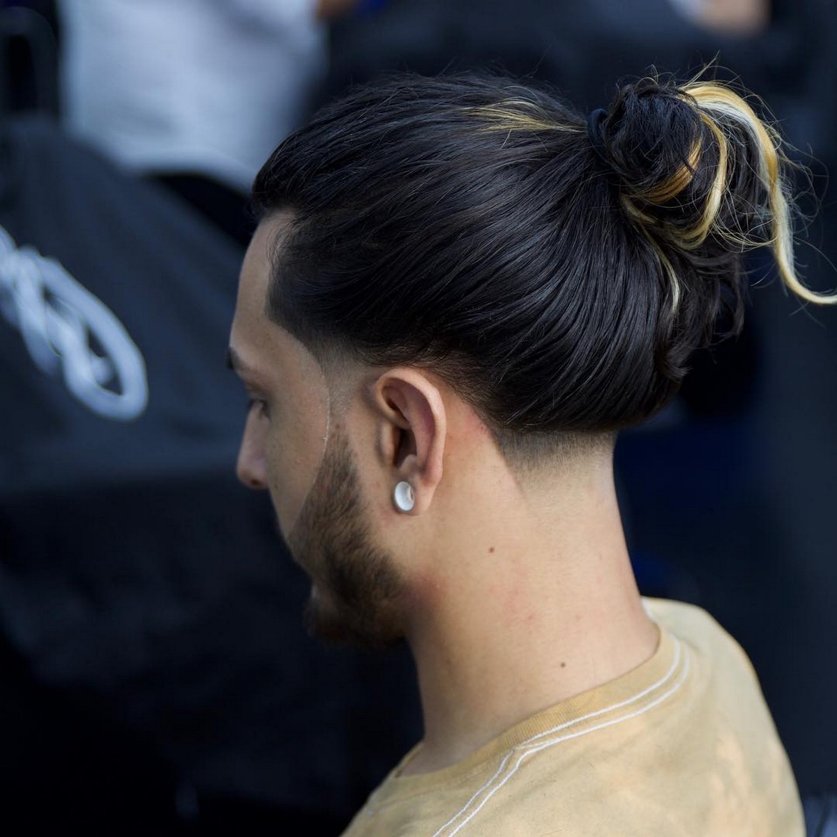 Low Taper Undercut With Bun And Yellow Highlight