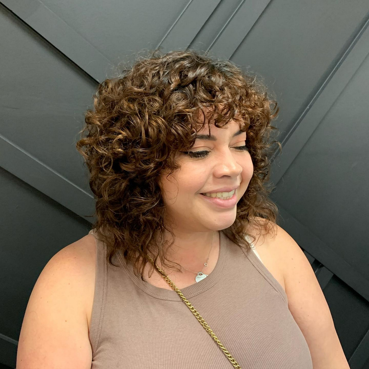 Shoulder-Length Curly Cut With A Fringe