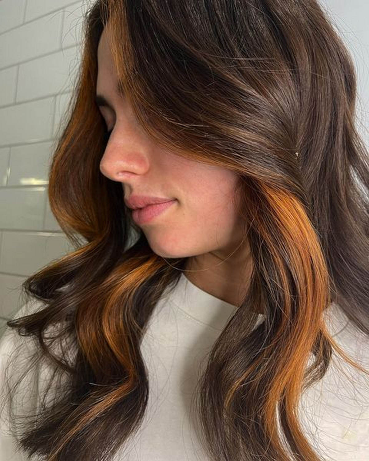 Copper Peekaboo Highlights On Brunette