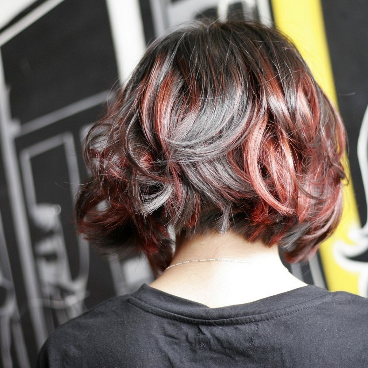 Layered Black Bob With Red Highlights