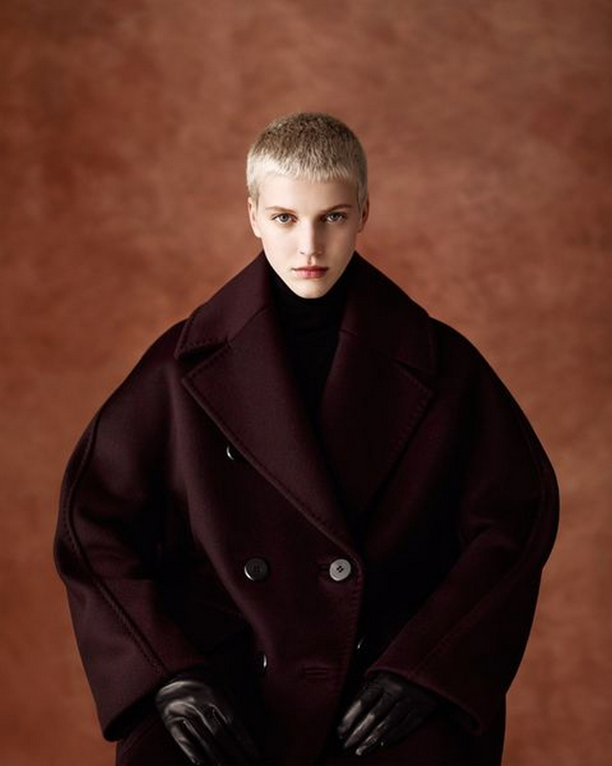 Chocolate Red Leather Overcoat With Black Turtleneck And Black Gloves