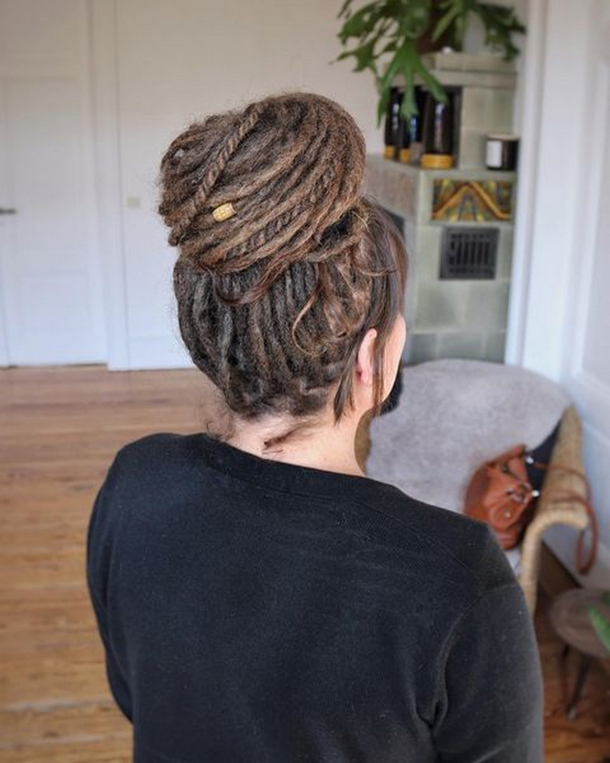 Long Dreadlocks With Flat Twists And An Up-Do Bun 