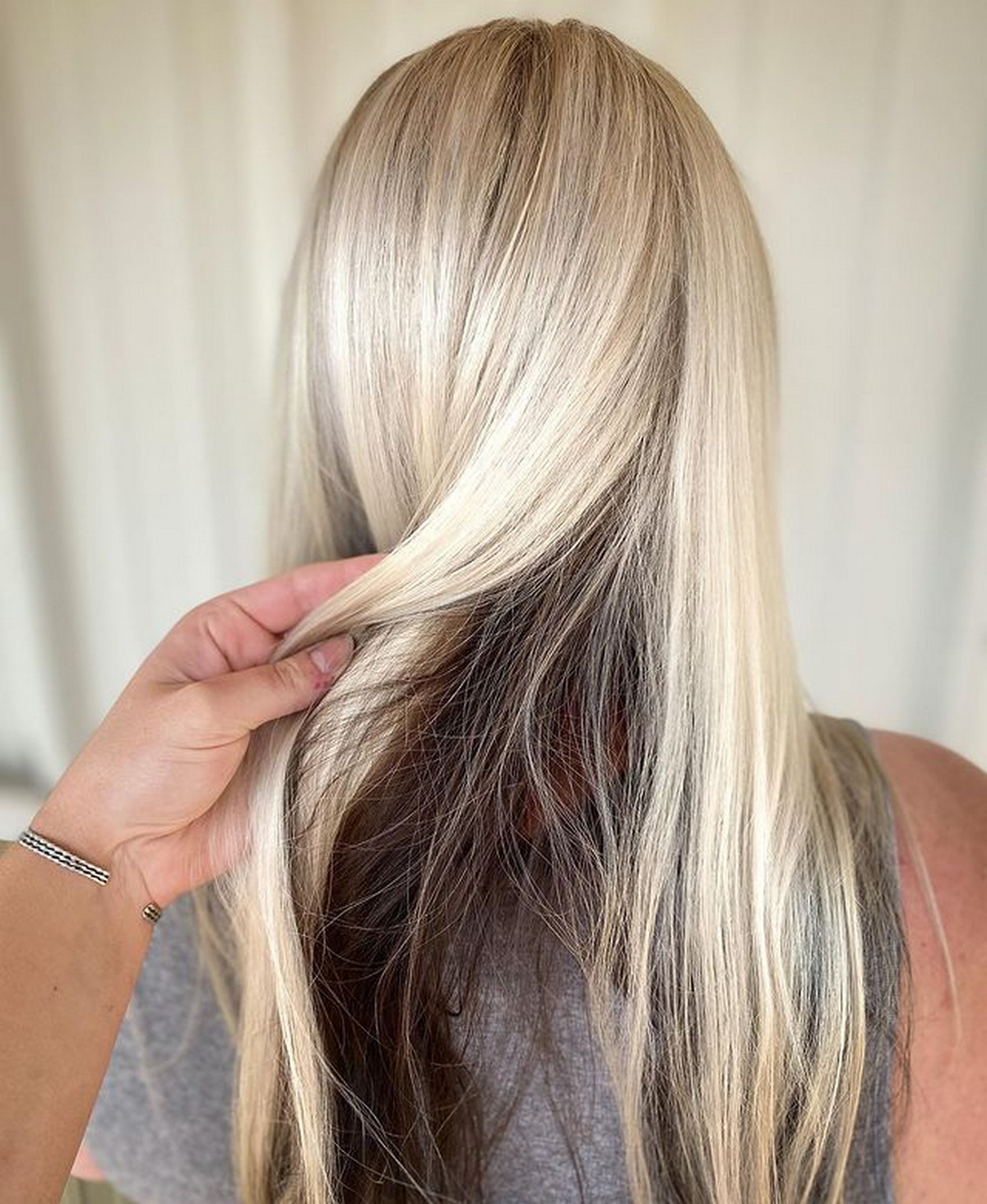 Brown Peekaboo Highlights On Platinum Blonde