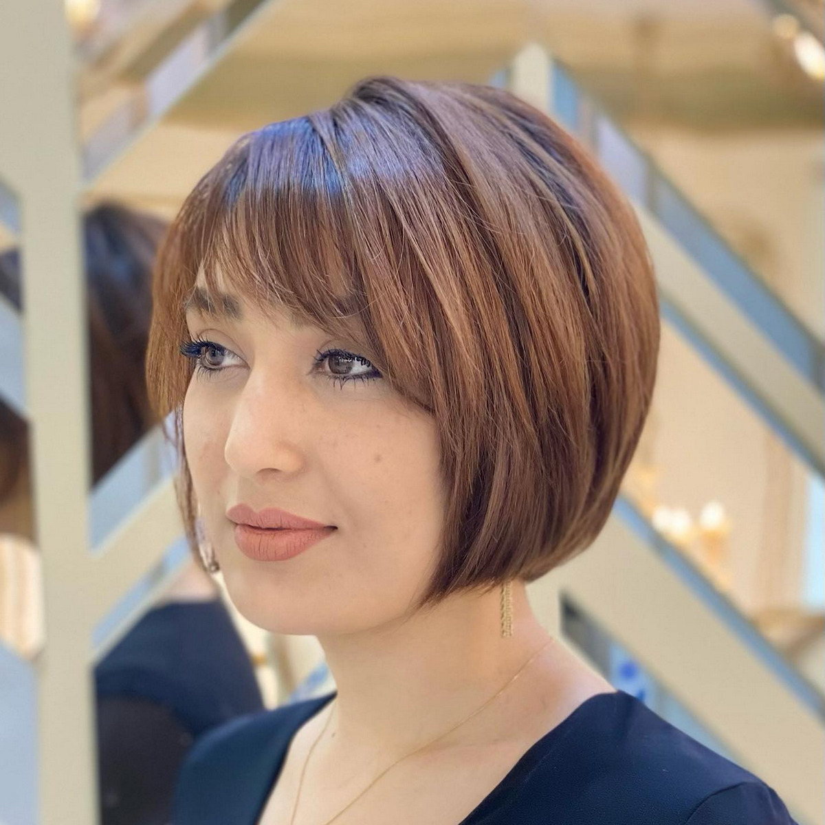  Short Caramel Bob With Feathered Bangs