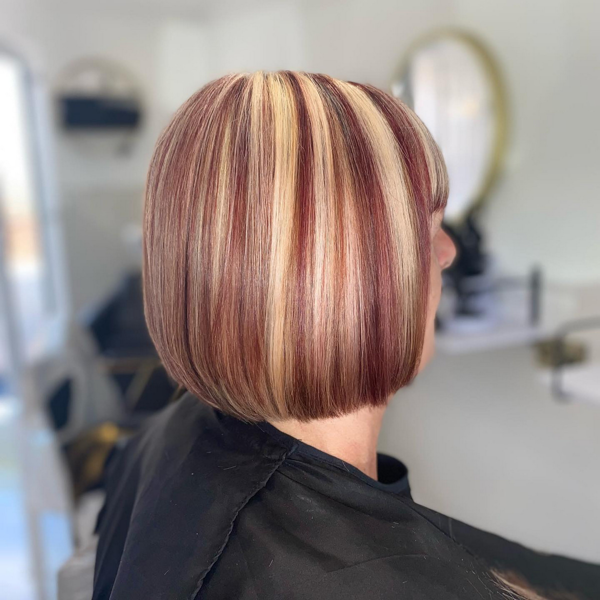 Short Blonde Bob Hairstyle With Red Wine Highlight