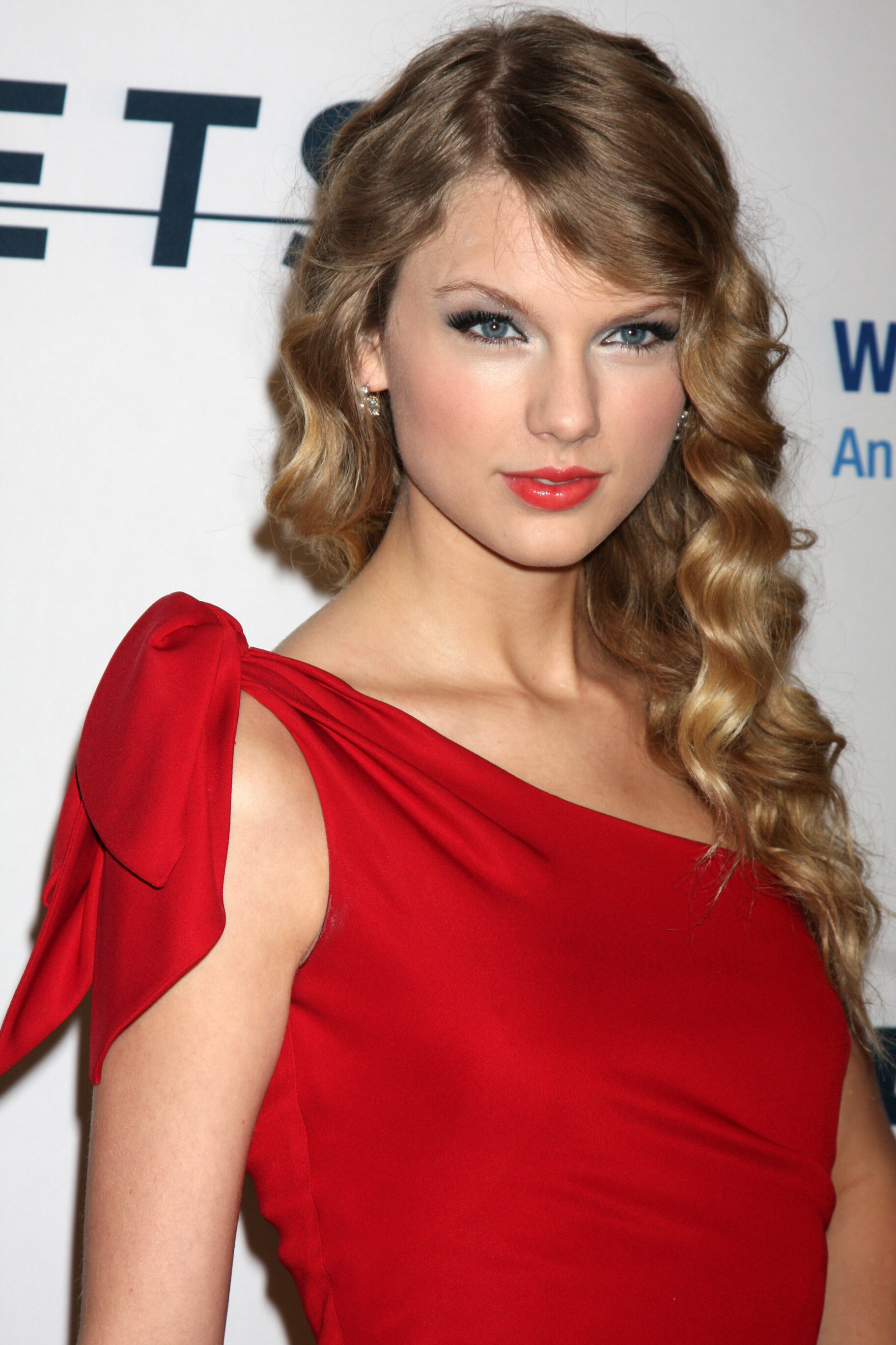 Curly Caramel Brown Hair With Side-swept Bangs