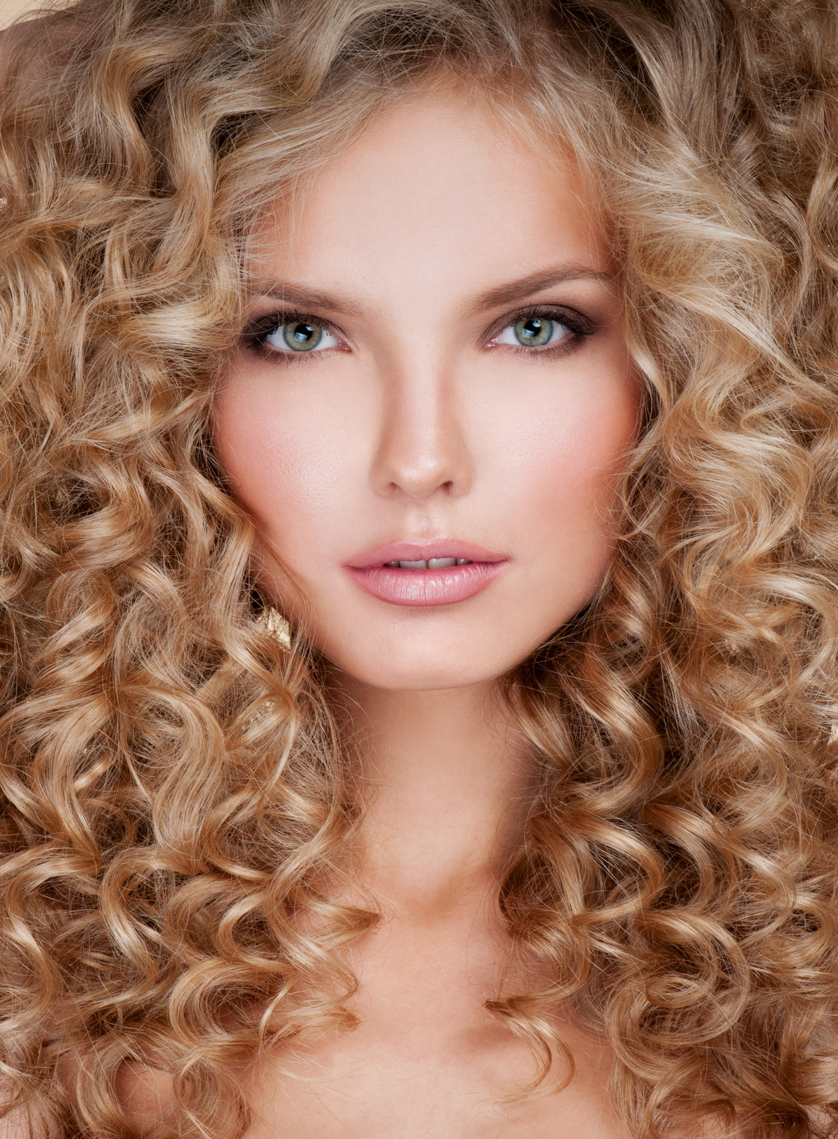 Long And Luxurious Blond Curly Permed Hair