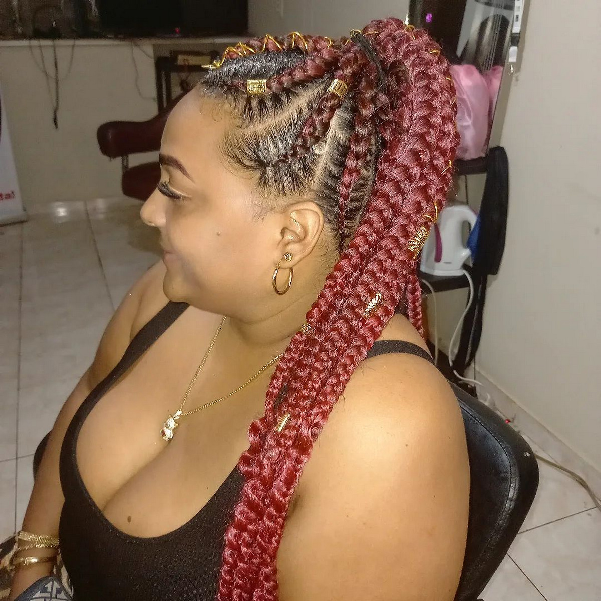 Red Feed-In Braids In A Big High Pony
