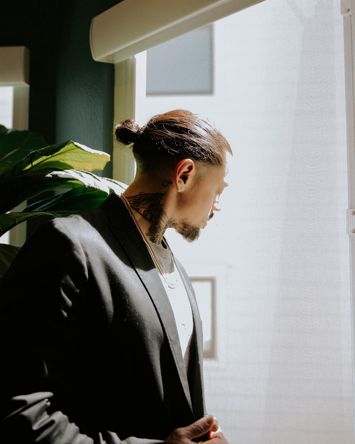 Low Man Bun With An Undercut In The Back