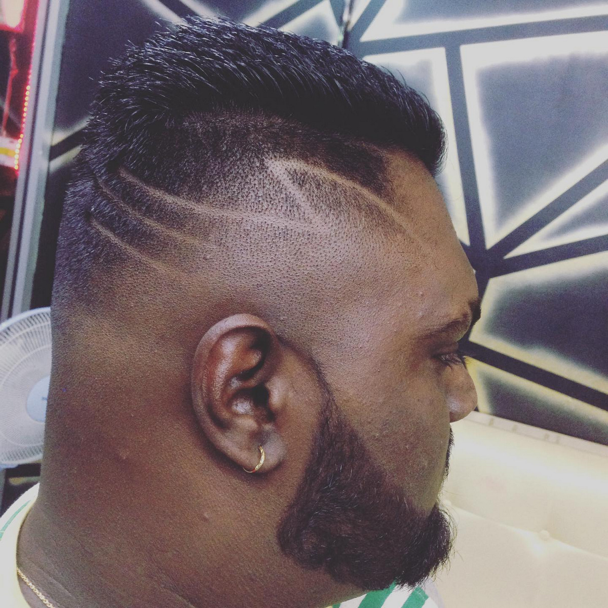 Fade With Shaved Lines Haircut