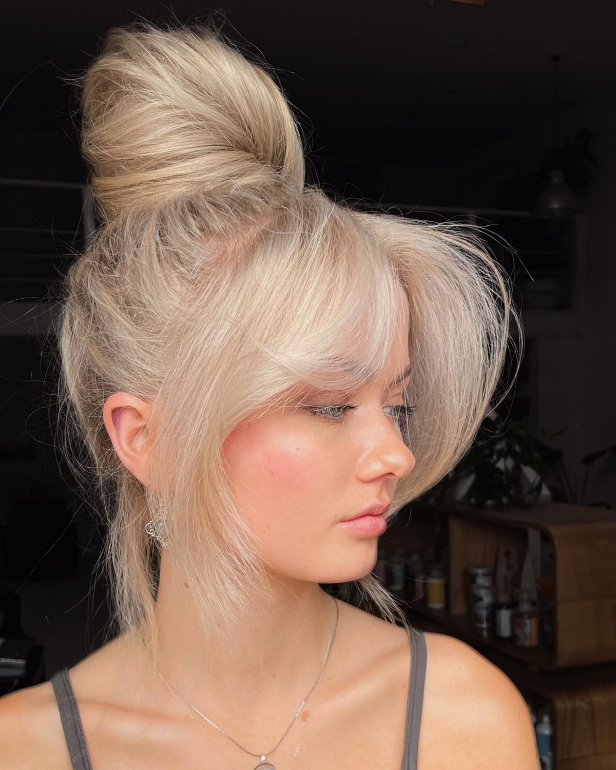 High Bun With Curtain Bangs