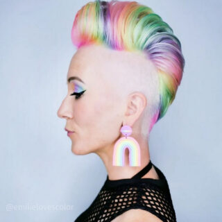 A vibrant rainbow undercut pixie hairstyle, showcasing bold color choices that make a statement.