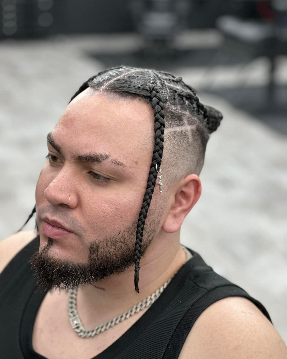 Two Braids In Front With A Man Bun Undercut