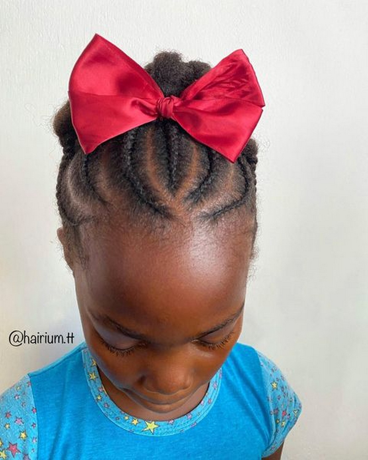 Updo Cornrows With A Big Red Bow
