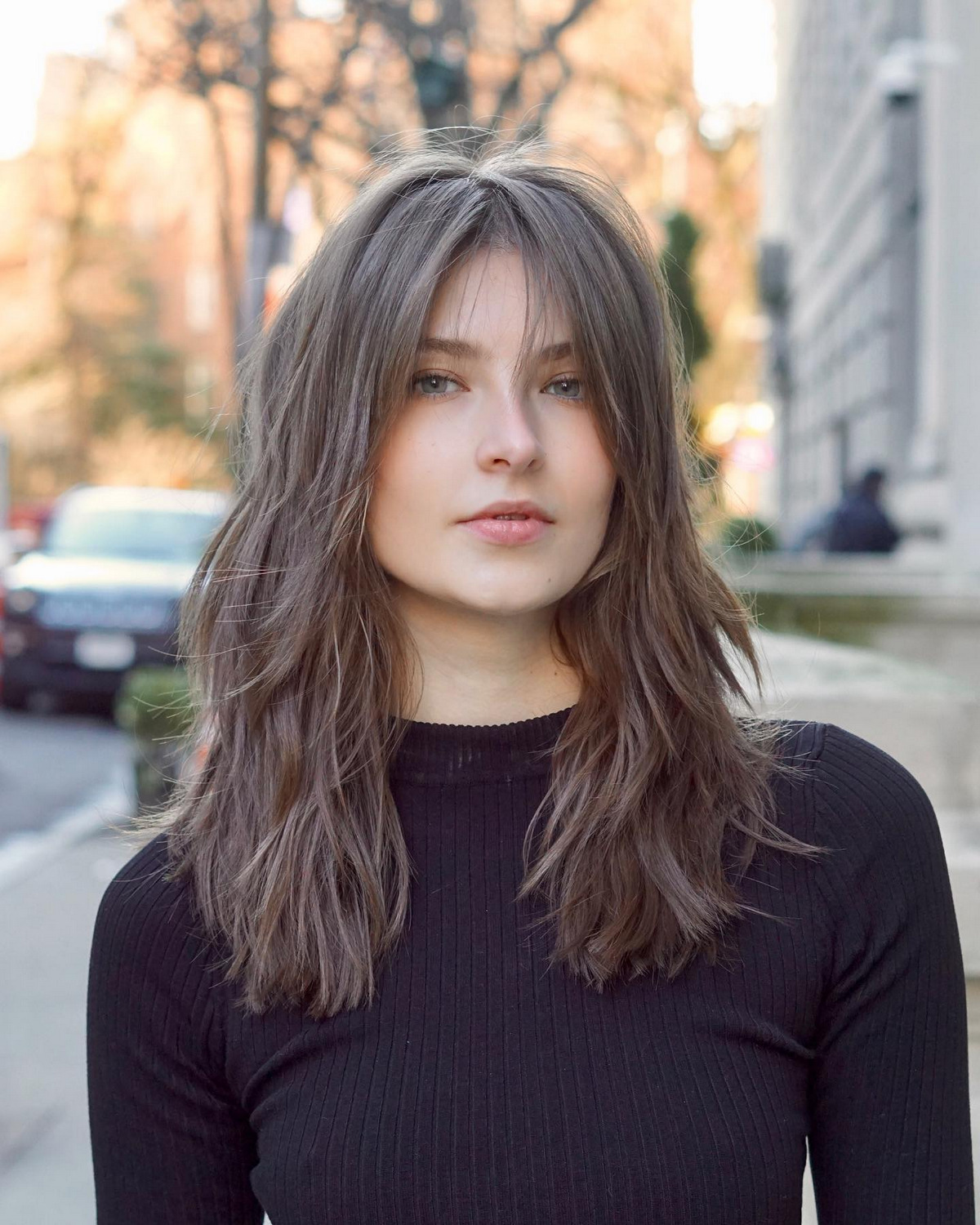 Brown Ash Layer of Hair With Wispy Bangs