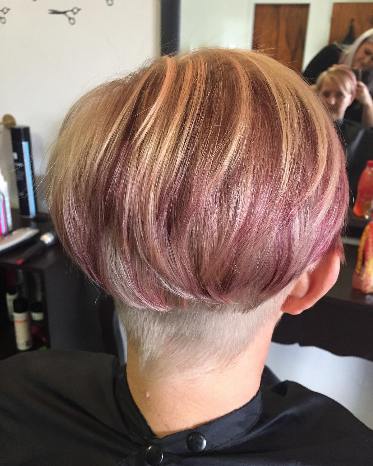 Pixie Blonde Cut With Red Violet Highlight