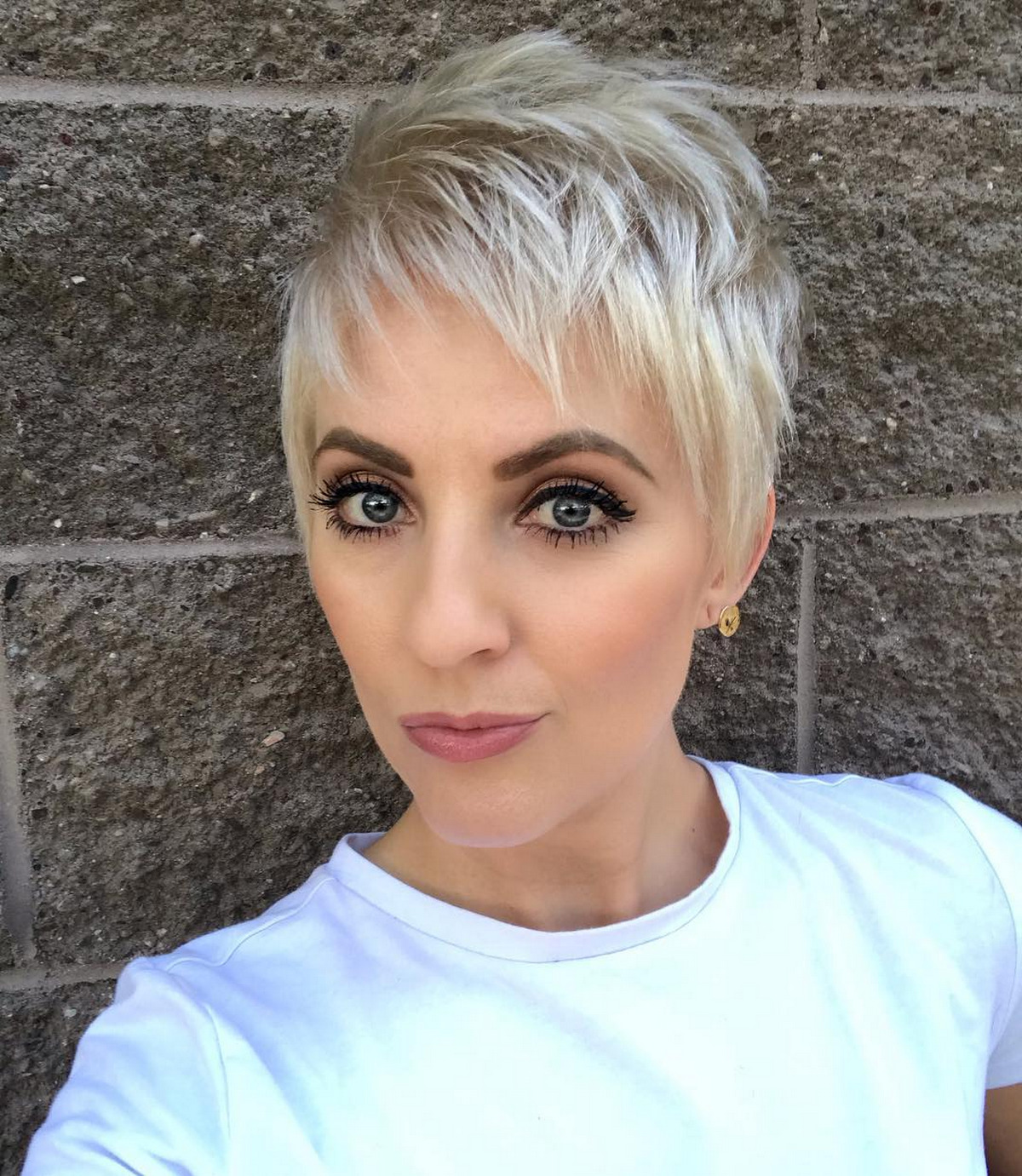 Blonde Pixie Hair With A Layer Of Bangs