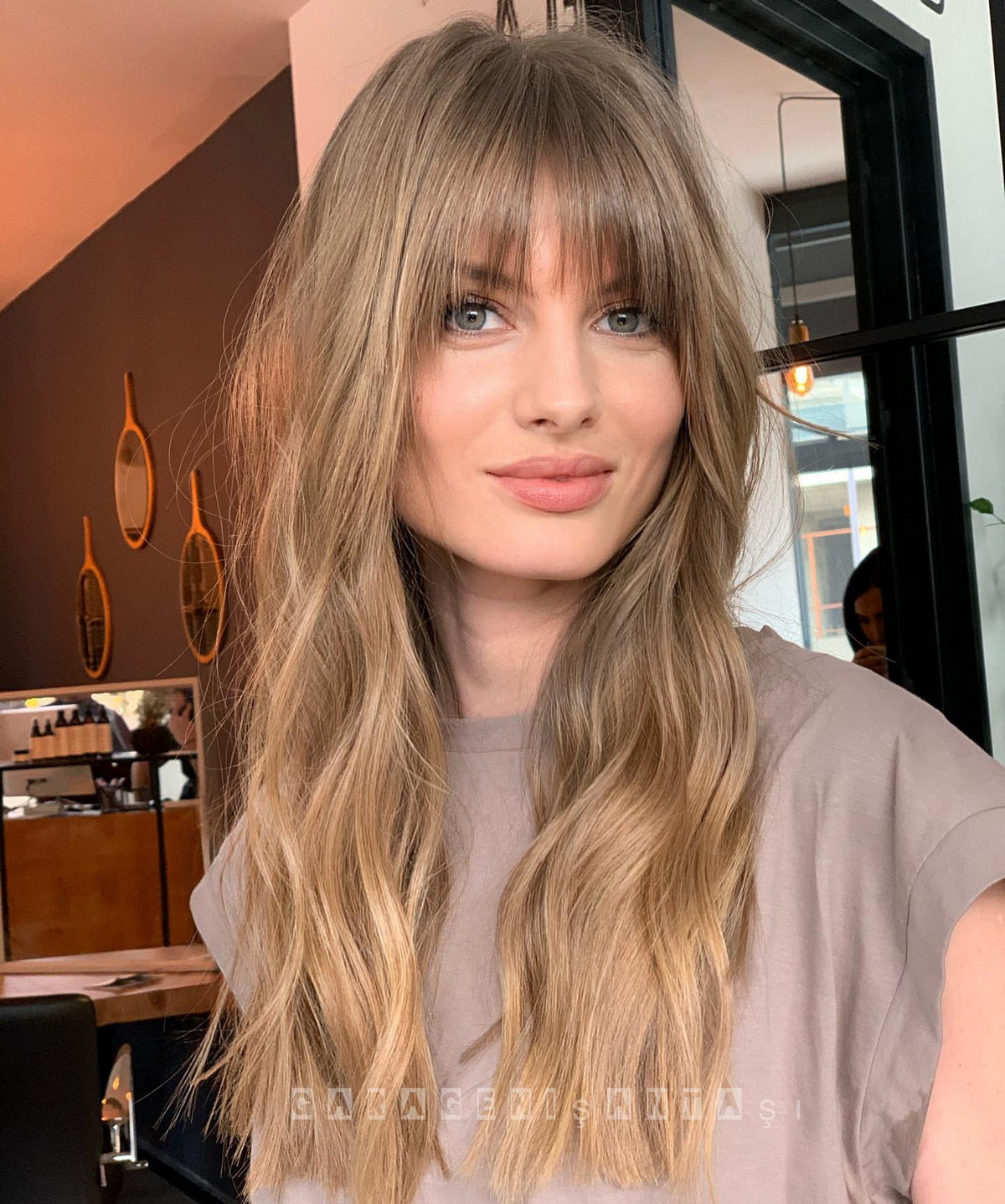 Balayage And Feathery Wispy Bangs