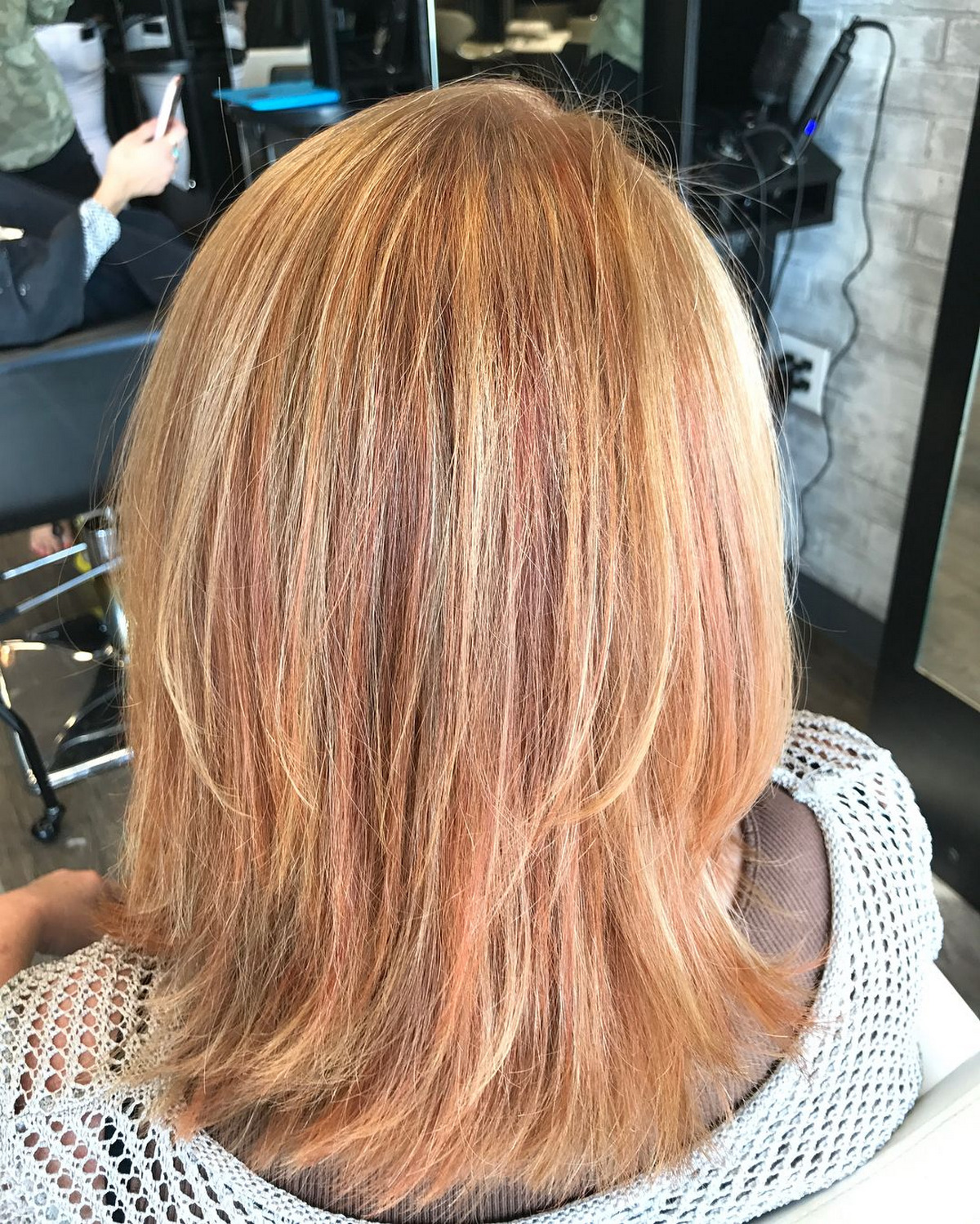 Medium Length Blonde With Subtle Red Highlights