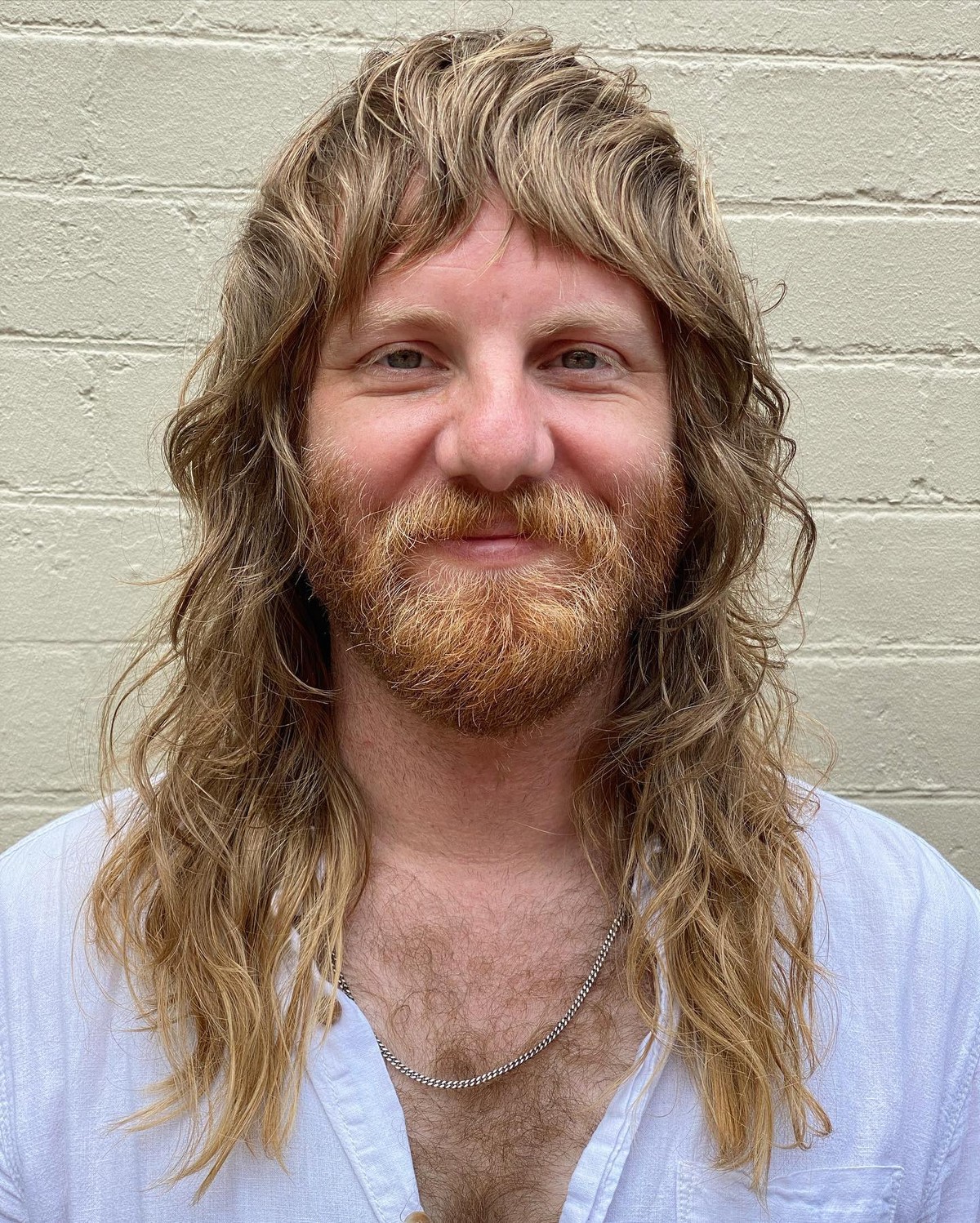 Blonde Waves With Choppy Curtain Bangs