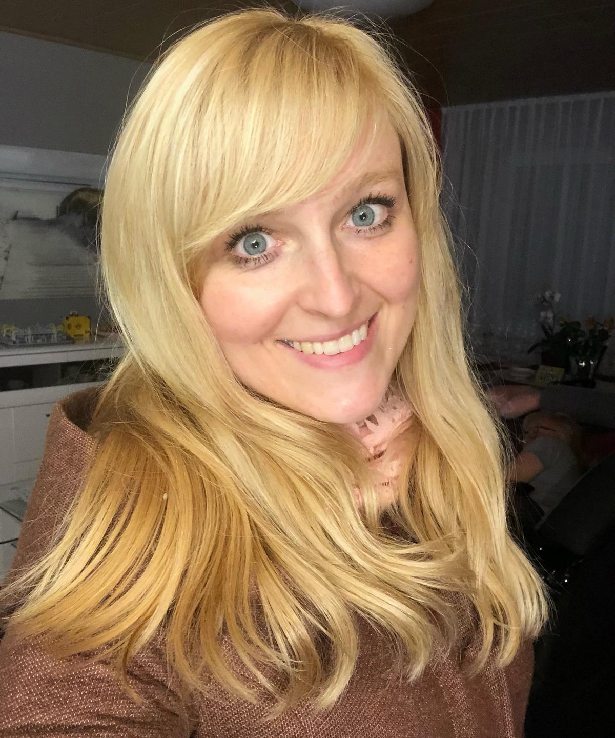 Shiny Straight Blonde Hair With Side Swept Bangs