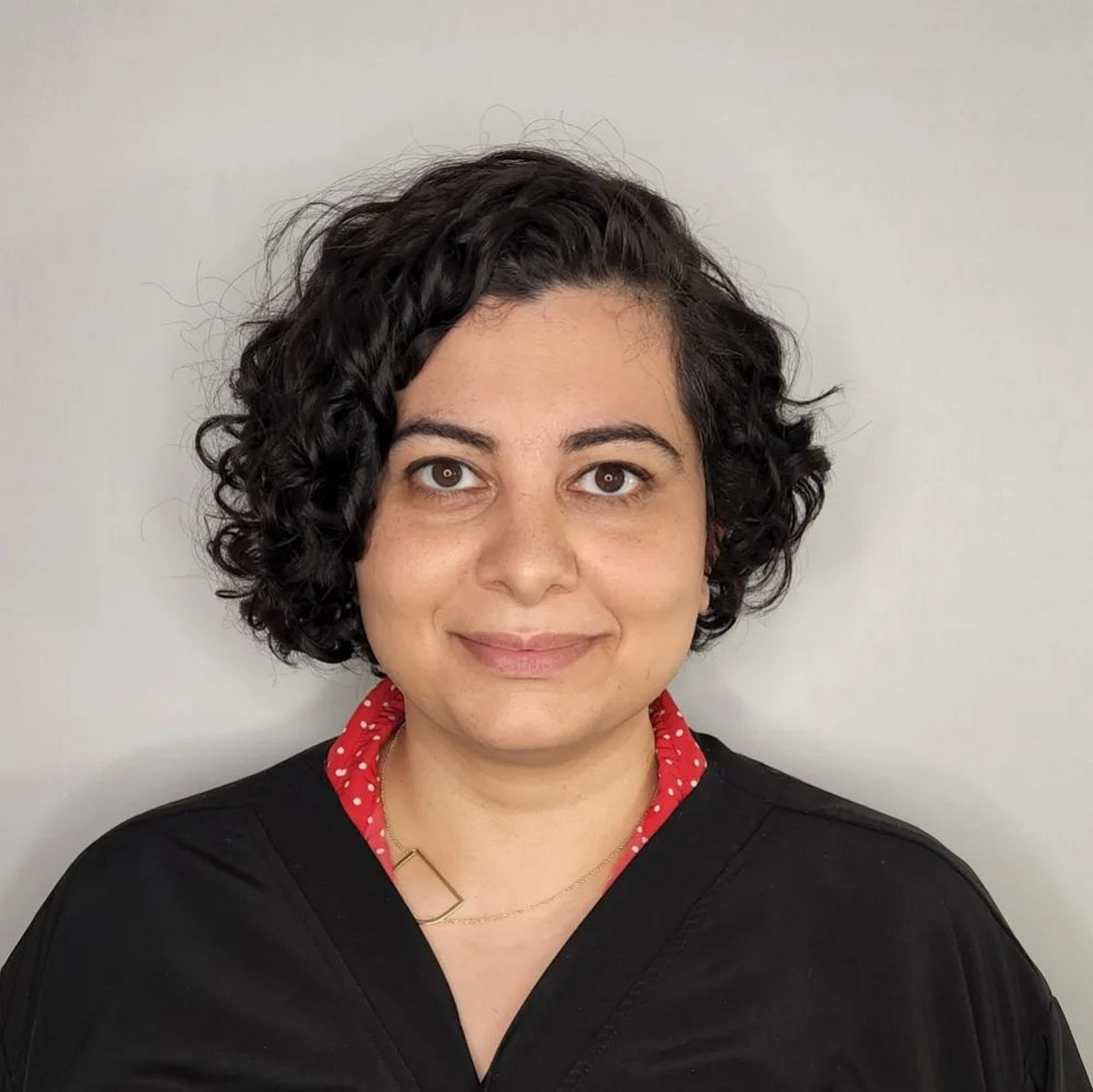 Asymmetrical Curly Bob For Round Face