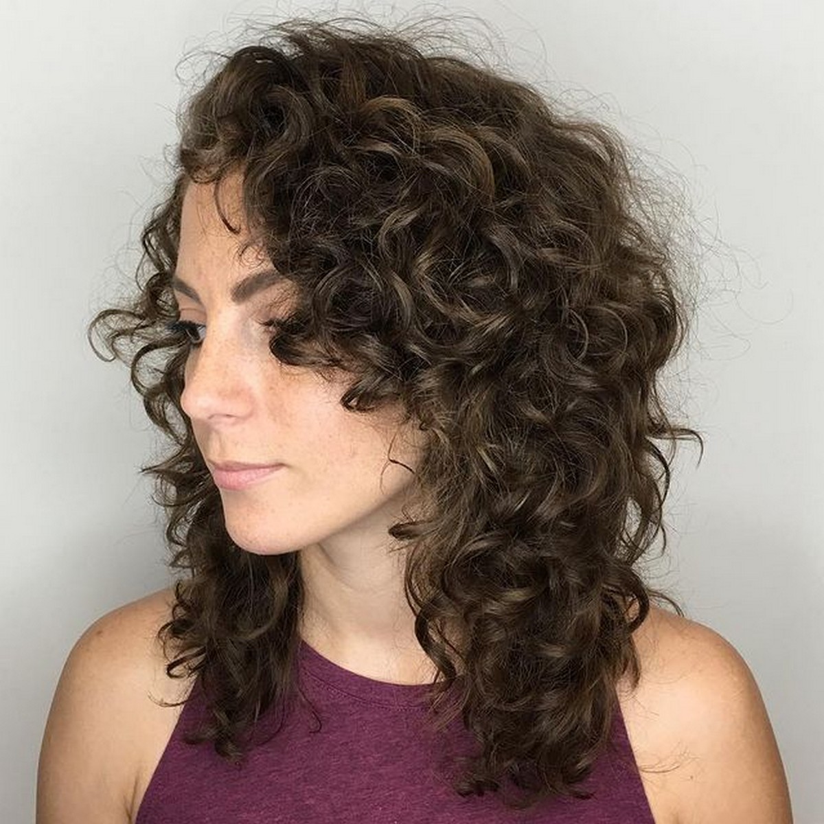 Medium Length Curly Layered Hairstyle