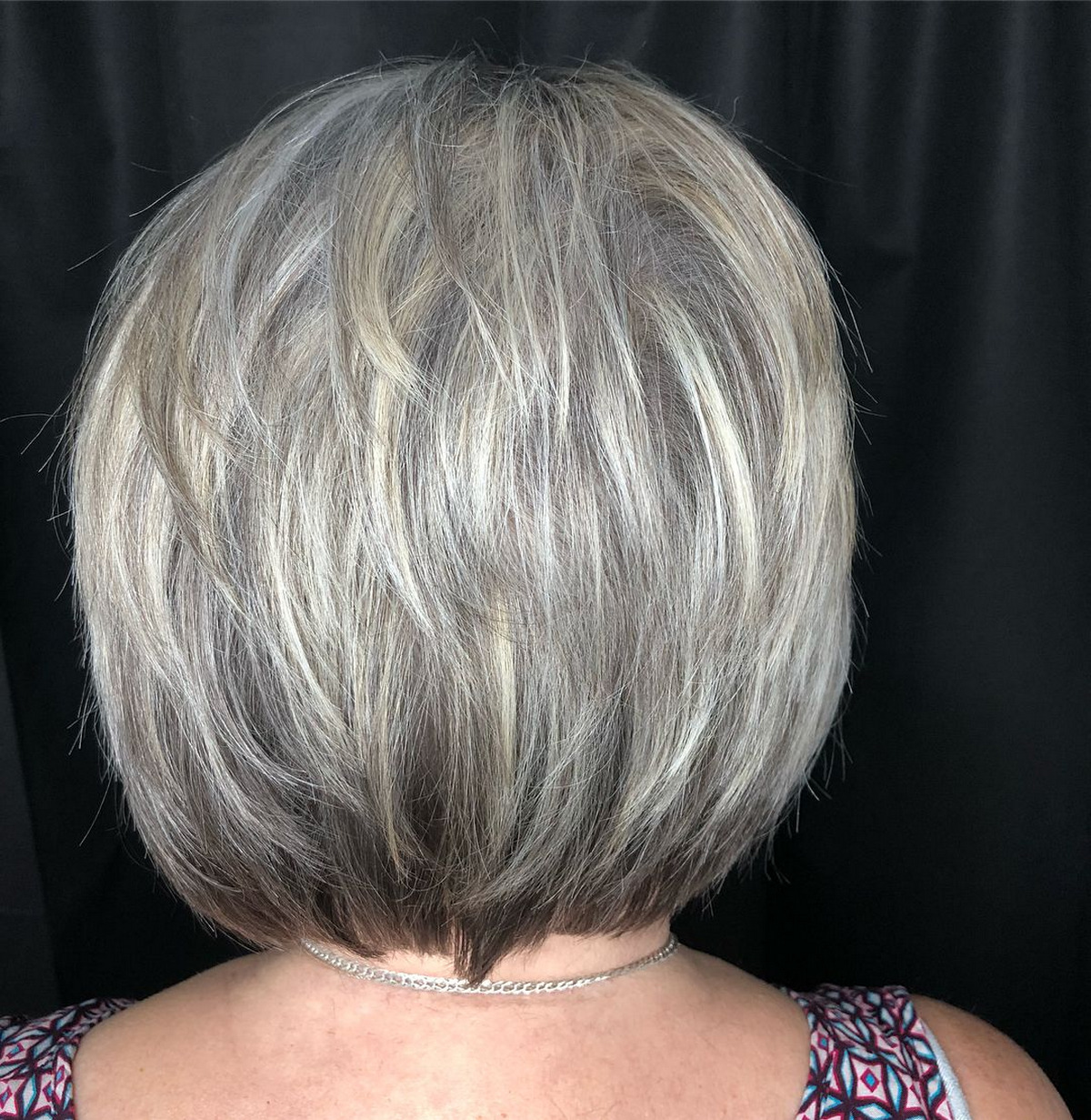 Feathered Style With White Highlights Short Hair