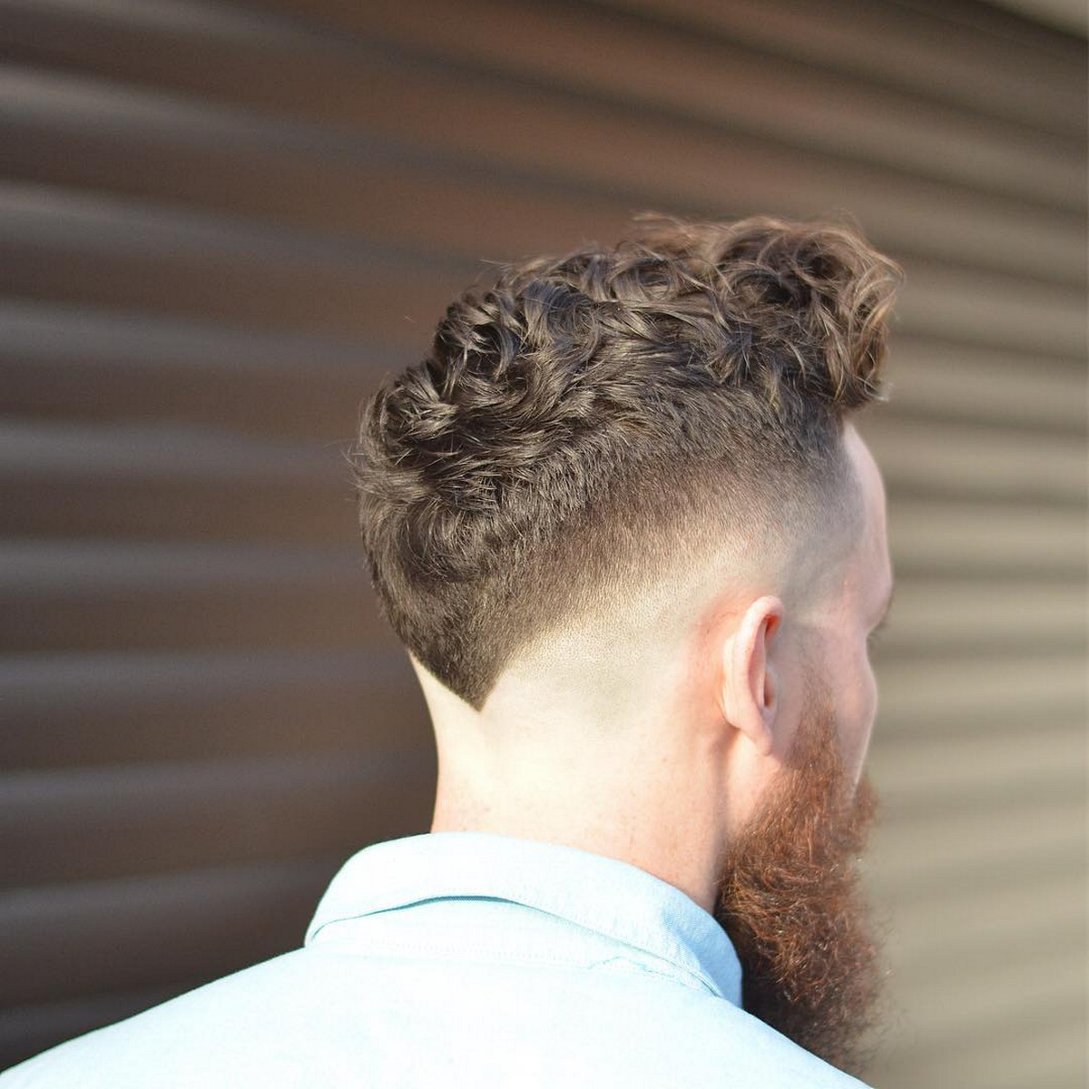 Zero Fade Curly Top With Blonde Beard