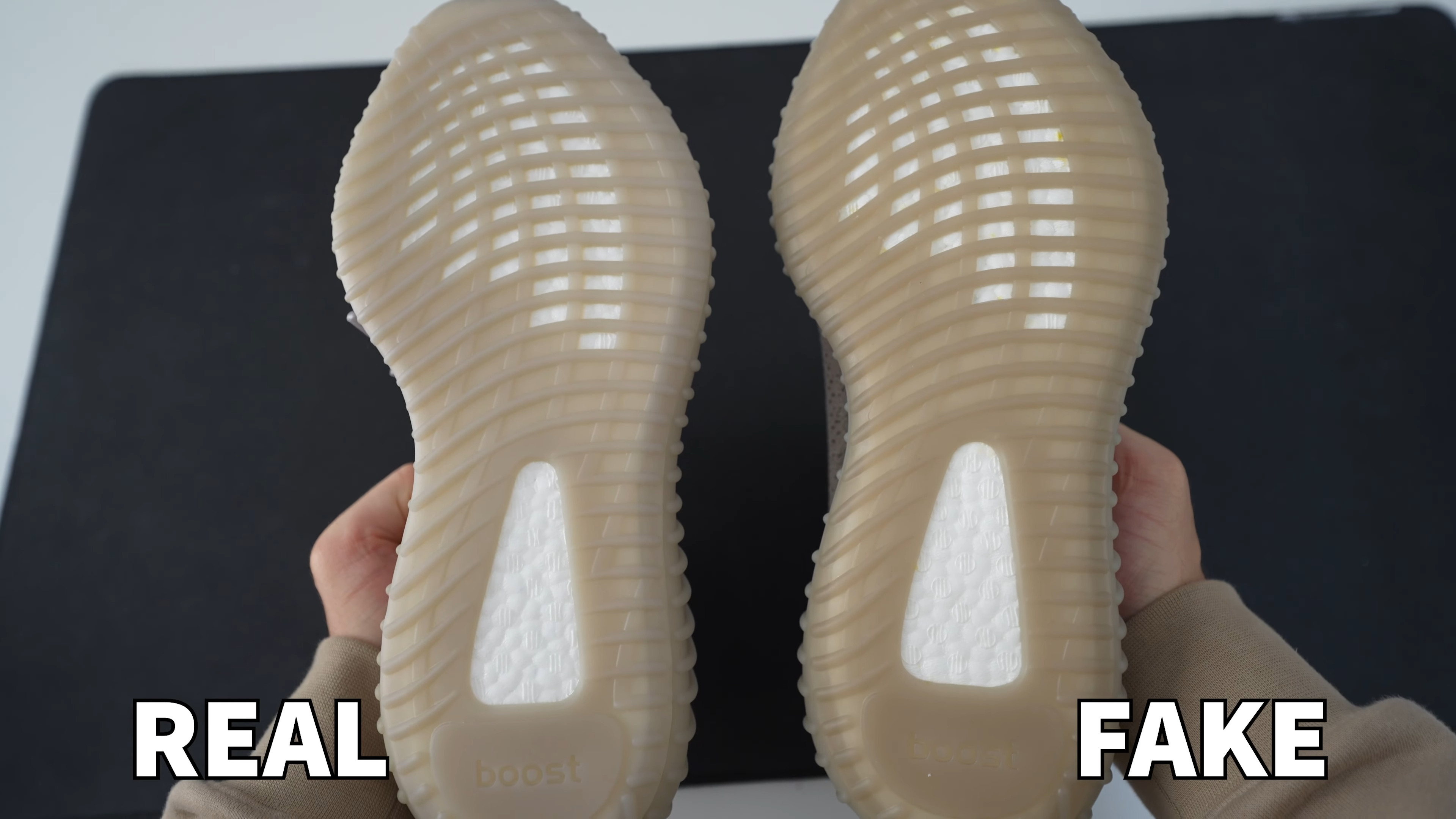 Comparing The color of outsole of the real yeezy 350 on the left and fake on the right.