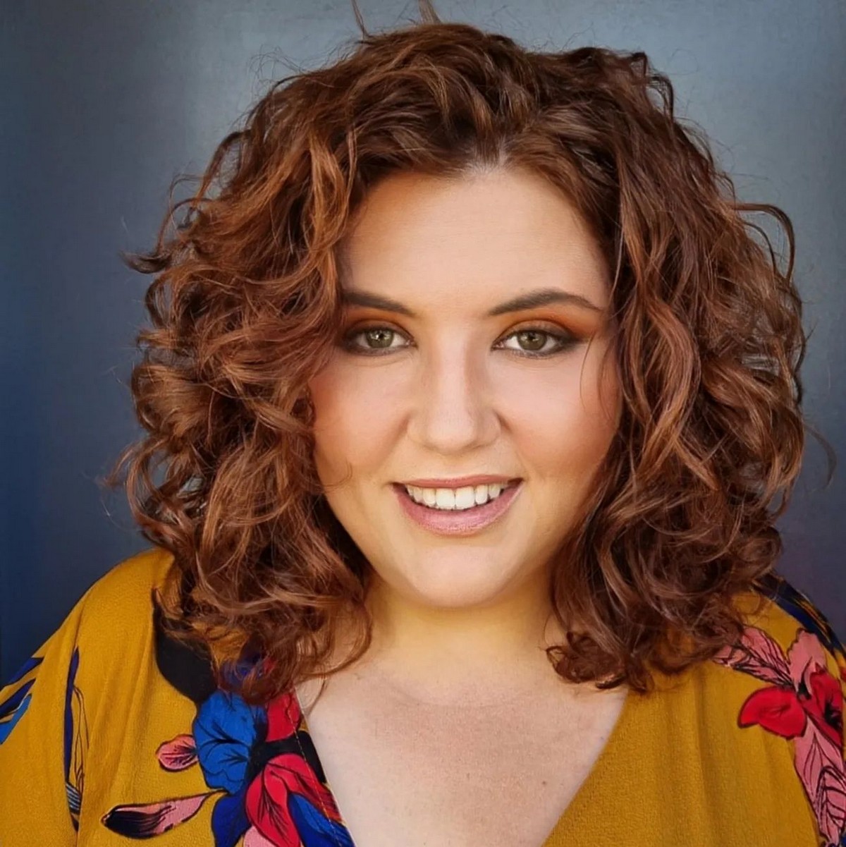 Medium-Length Blonde Curly Hair With A Side Part