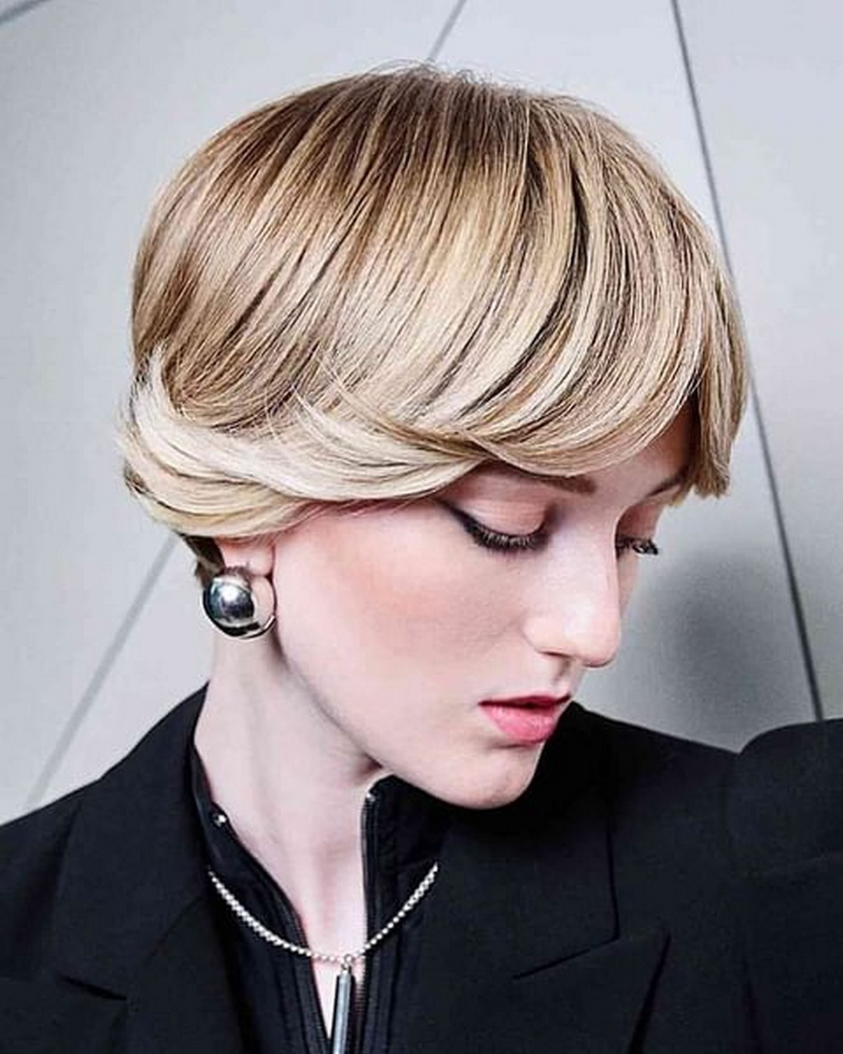 Short Blonde Bob With Dark Roots And Flipped Bangs
