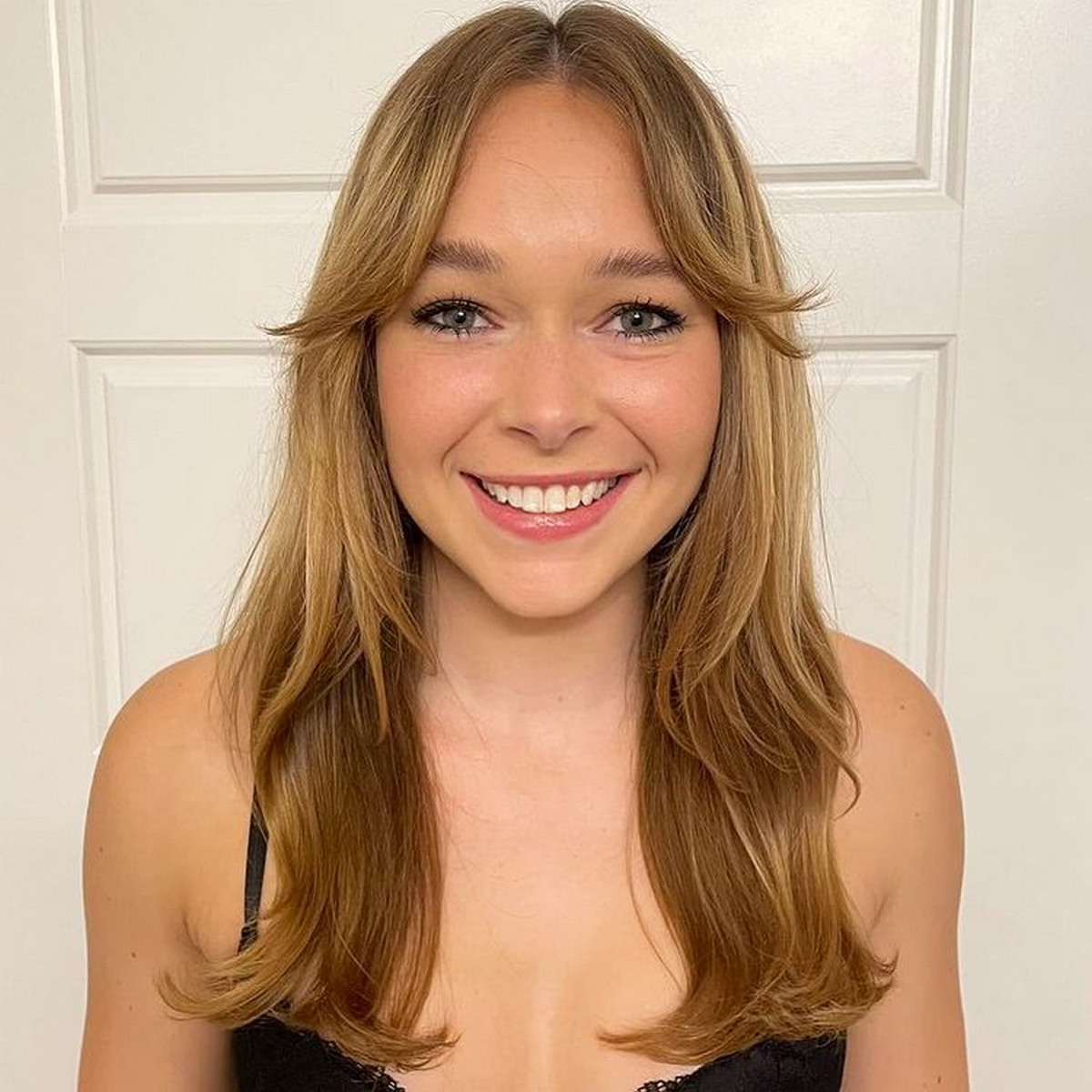 Layered Haircut with Center-Parted Bangs