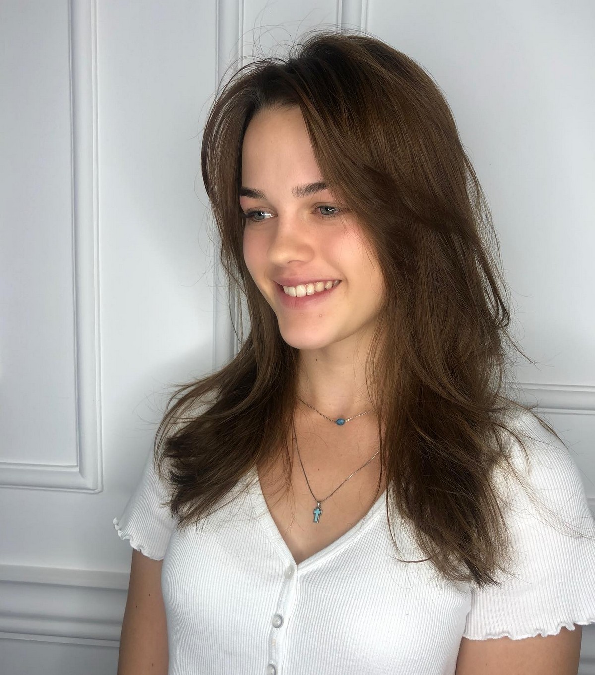 Layered Straight Hair With Parted Bangs
