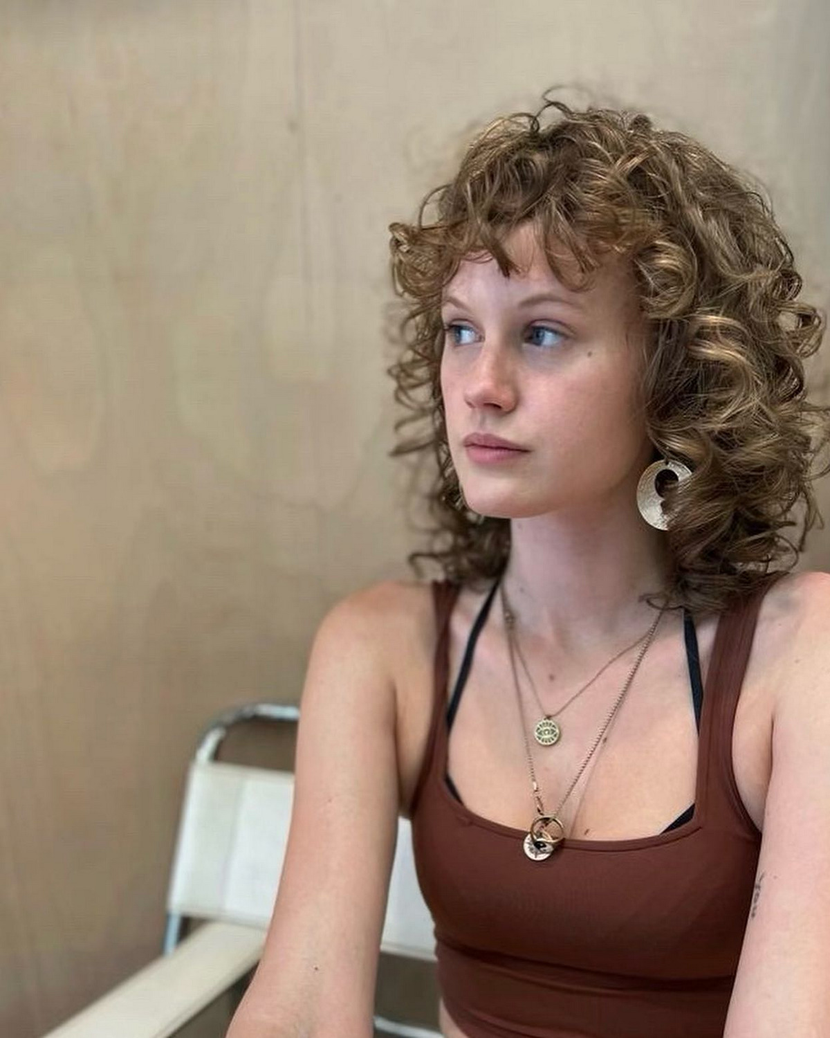 Curly Bangs With A Layered Haircut