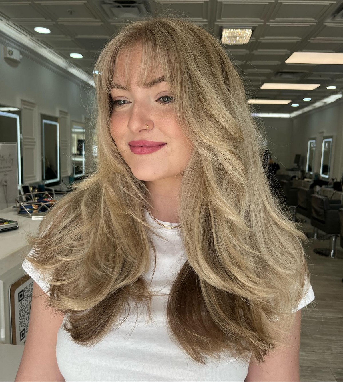 Blonde Butterfly Hair With Wispy Bangs