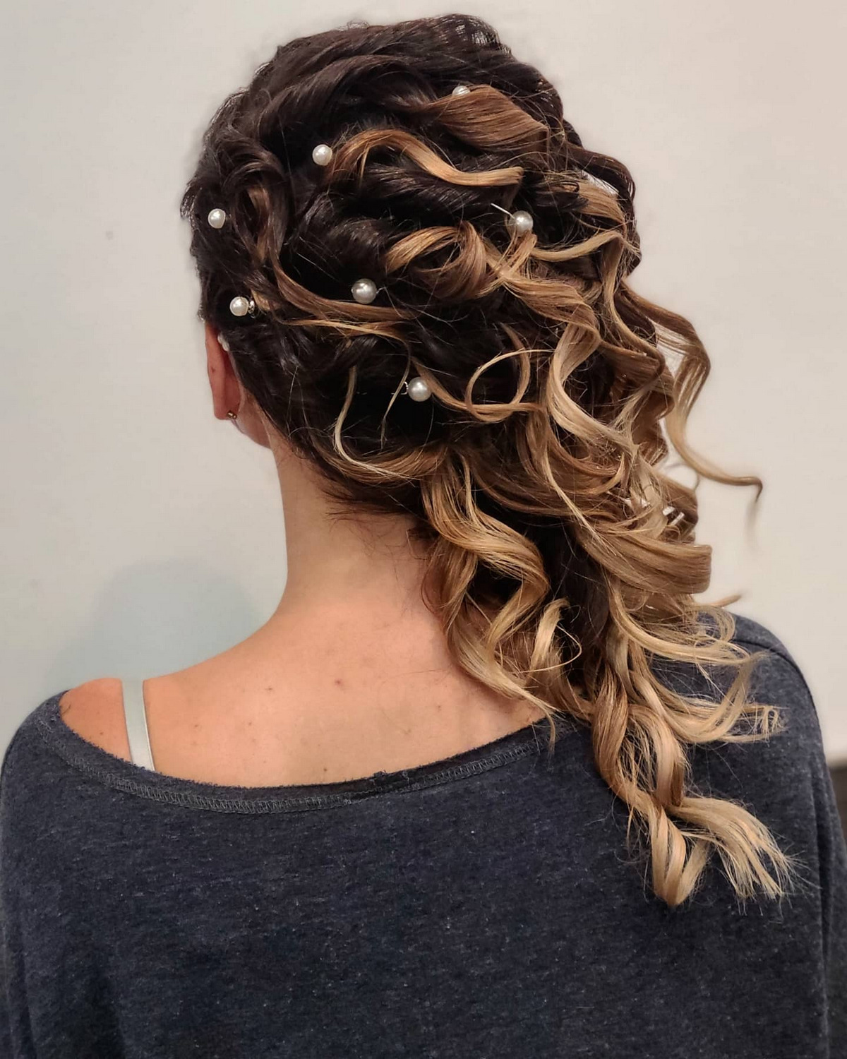 Curly Side-Swept Updo With Pinned Curls