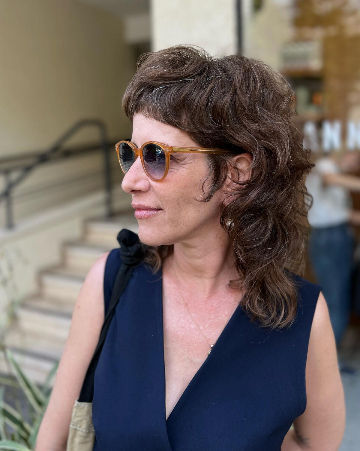 Curly And Shaggy Hairstyle With Bangs