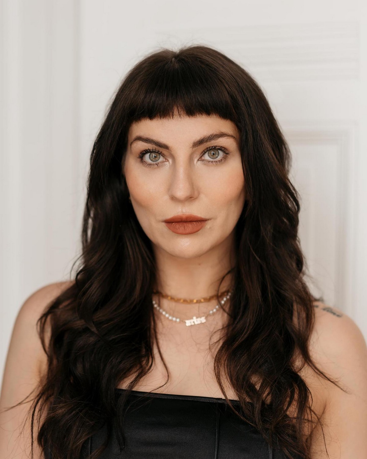 Short Blunt Bangs And Brunette Layers