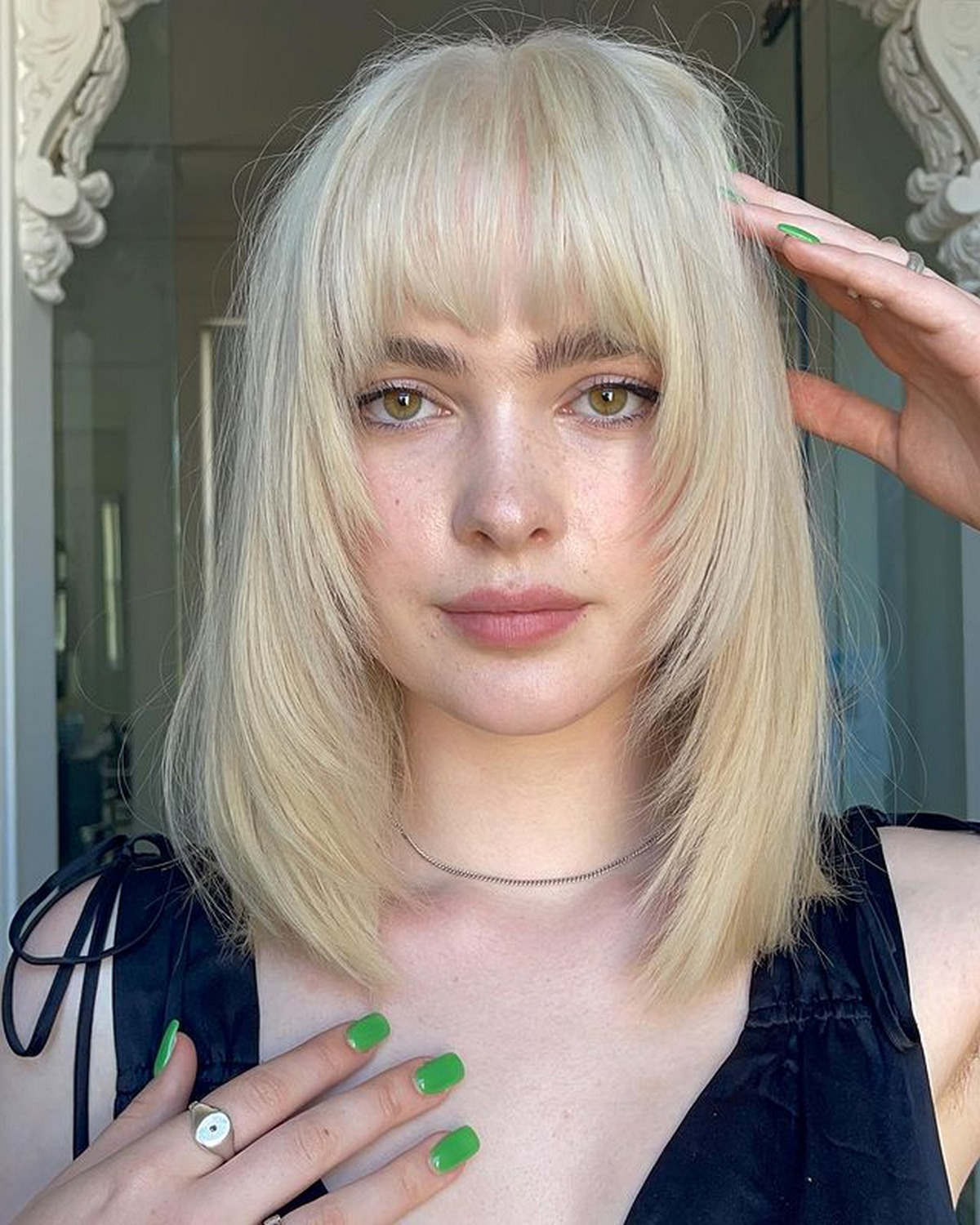 Voluminous Full Bangs with Feathered Layers