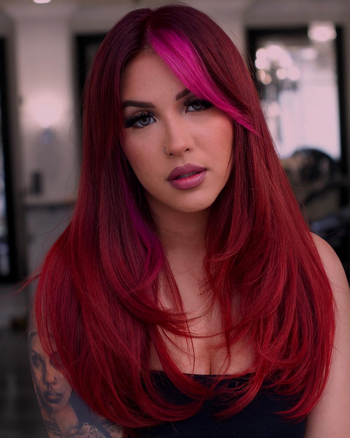 Layered Red Haircut With Highlighted Bangs