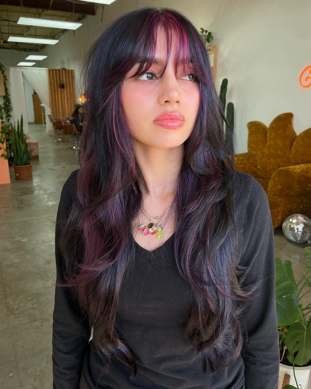 Wispy Bangs And Purple Pink Highlighted Layers