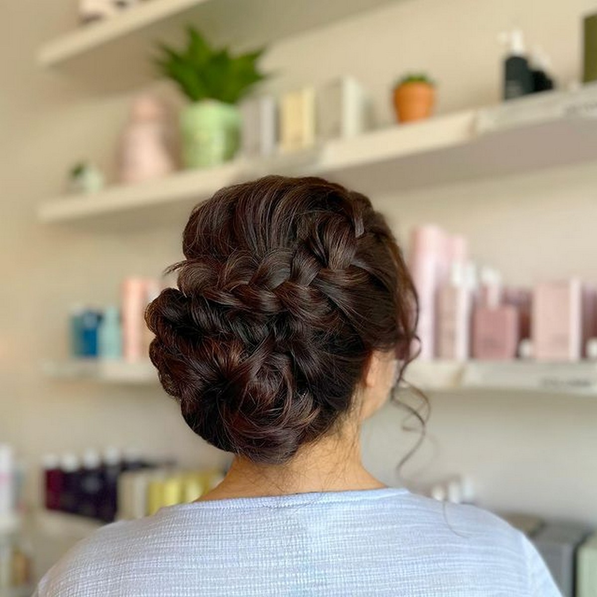 Messy Curly Updo With Face-Framing Tendrils