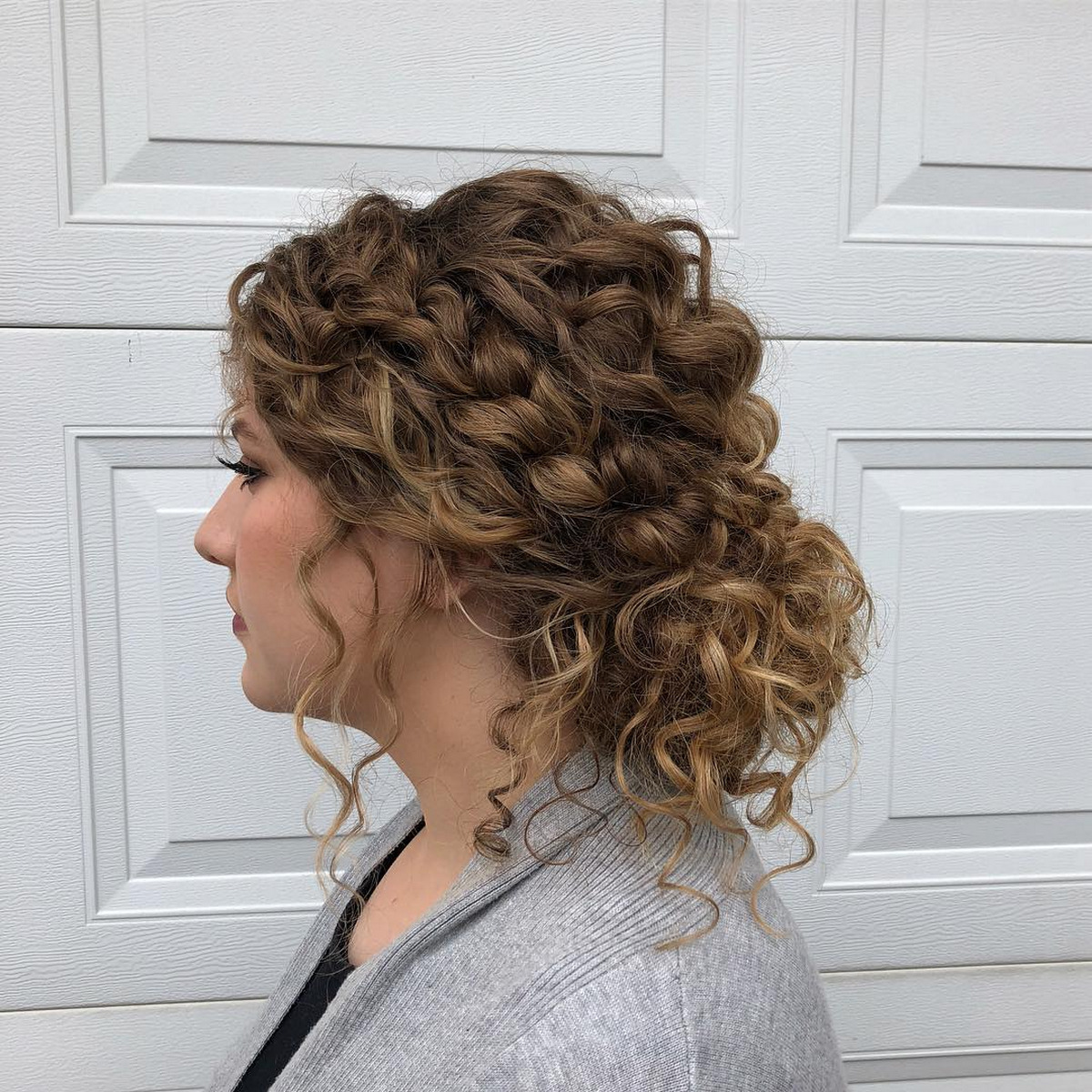 Low Curly Bun With Loose Curls