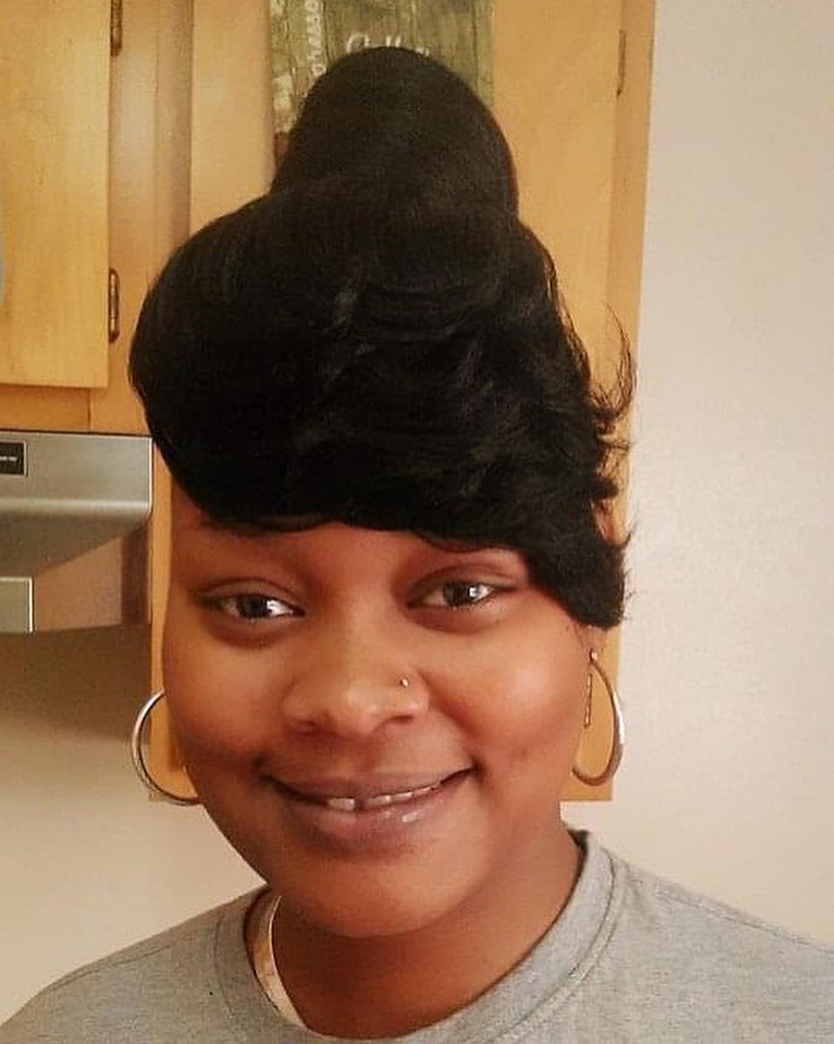 Low Bun With Deep Side Bangs
