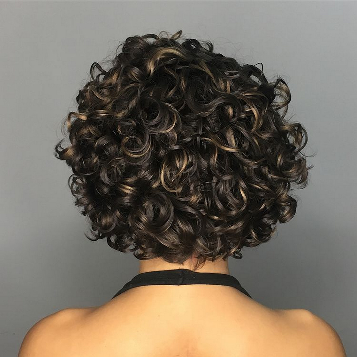 Curly Messy Brunette Bob With Golden Highlights