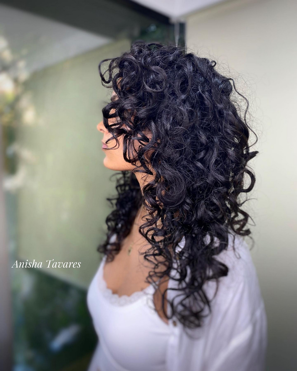 Mid-Length Curly Layered Cut